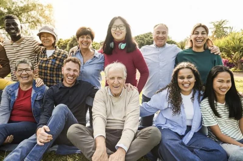 A community group sitting together outdoors