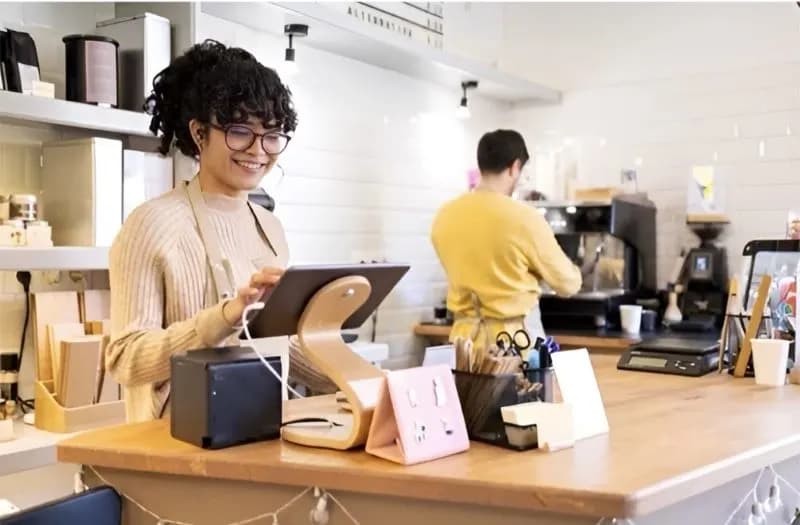 Staff at the counter of a busy café